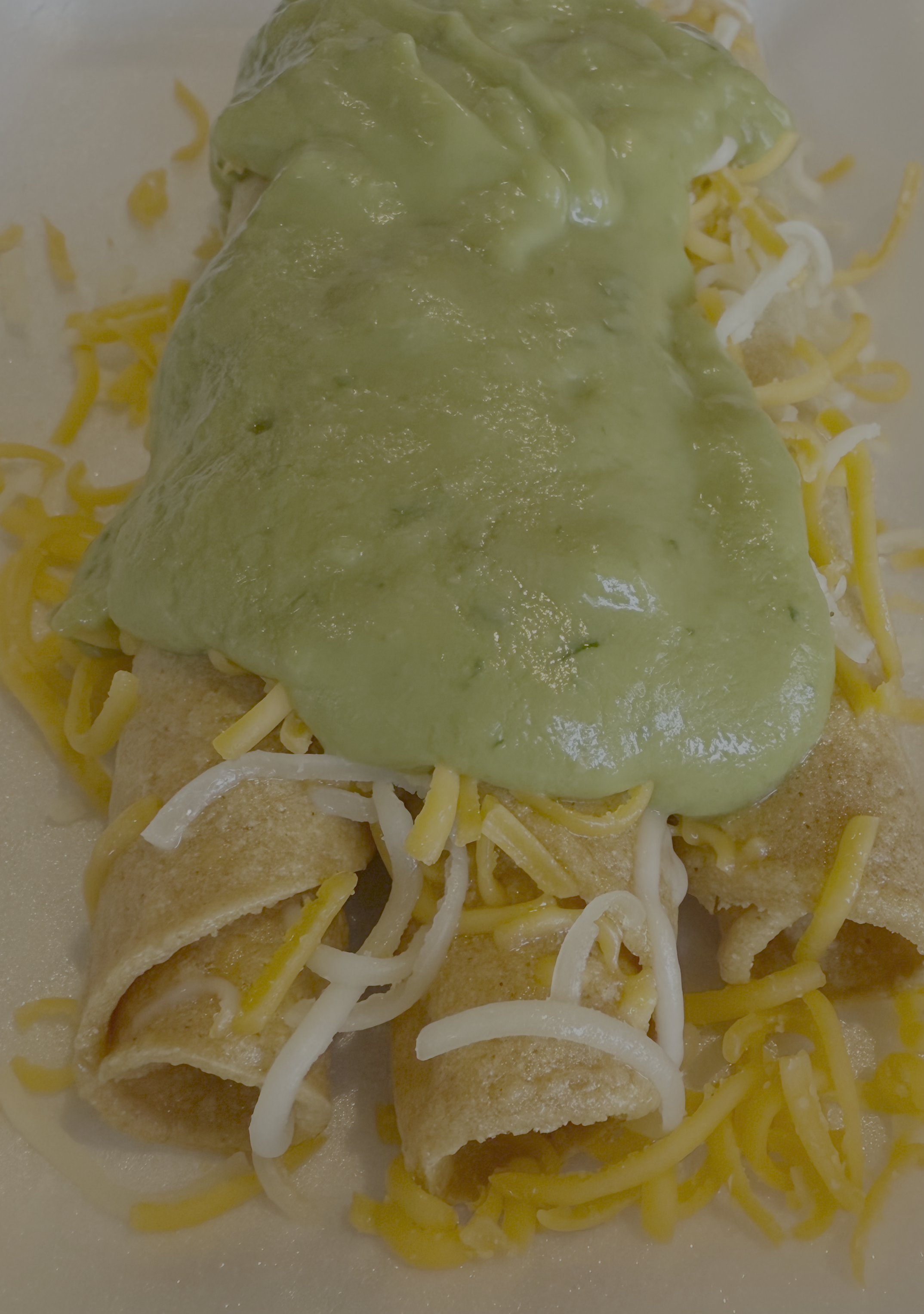 3 Rolled Tacos with Cheese and Guac.