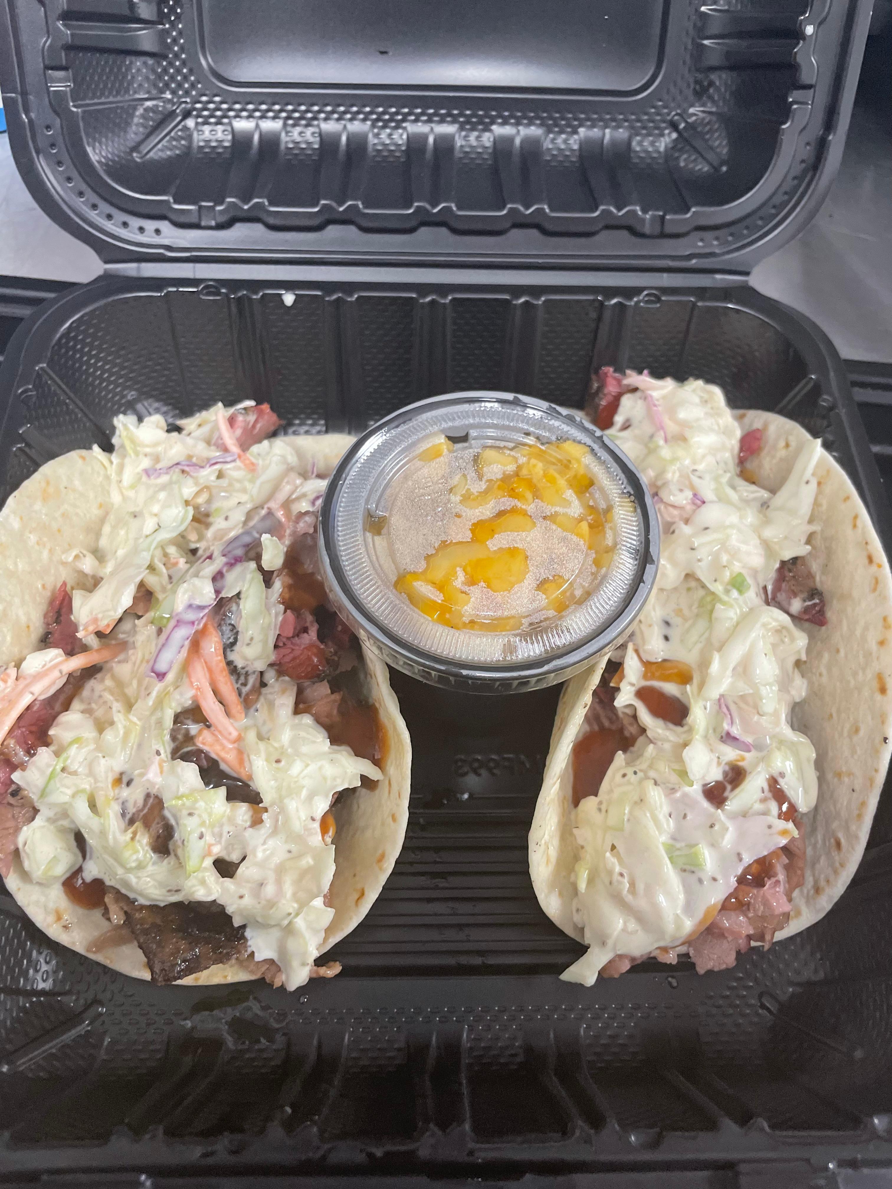2 Pulled Pork Tacos or Sliders with Small Side.