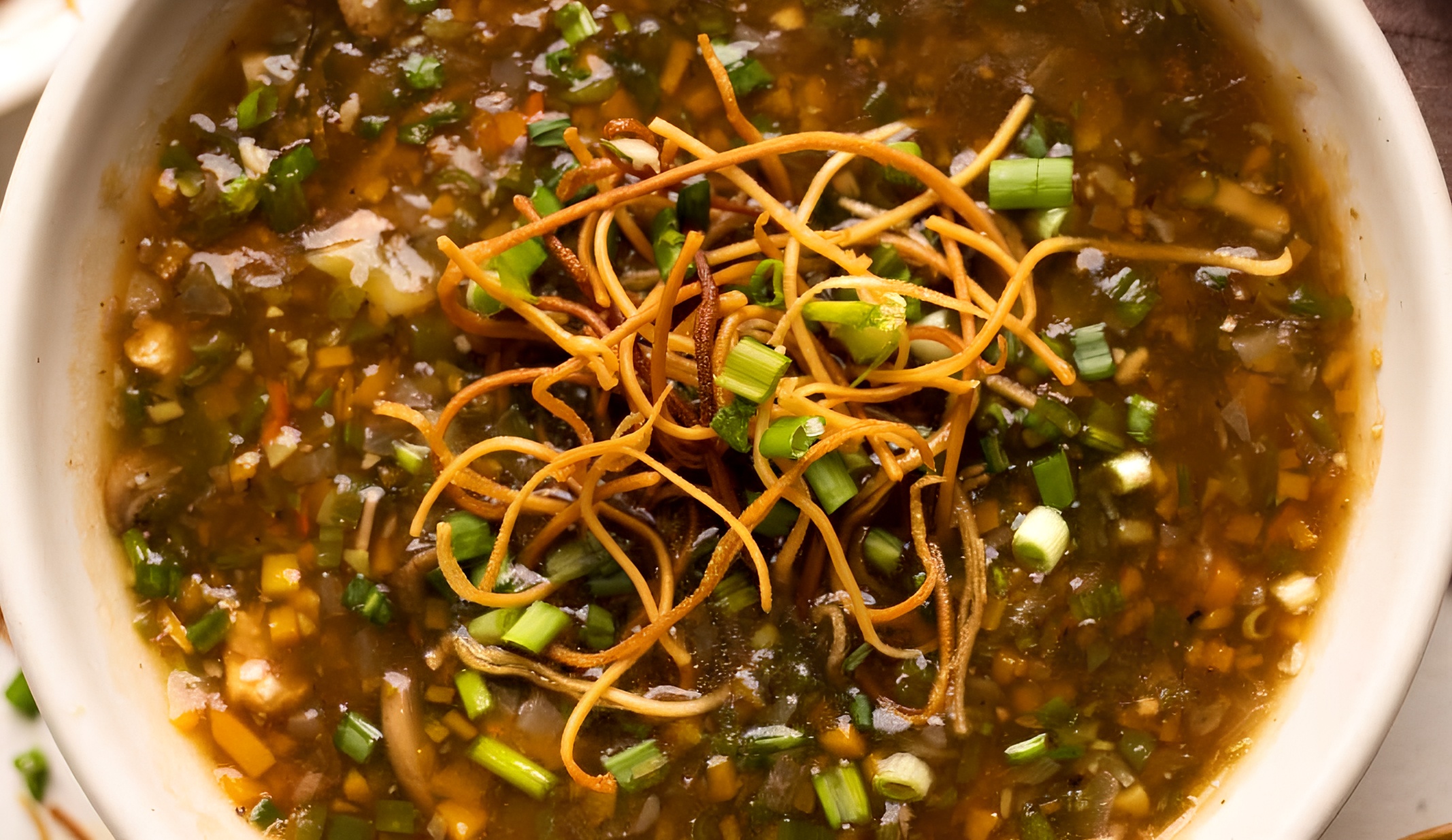Chicken Manchow Soup + Noodles (16oz).