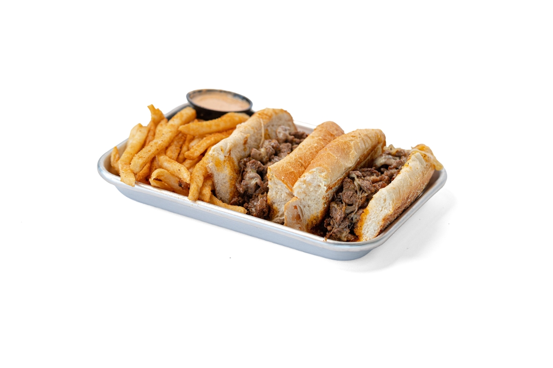 Beef Ribeye Cheesesteak with Seasoned Fries.