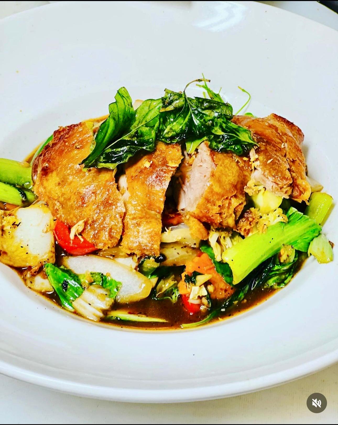 Roasted duck with basil sauce.