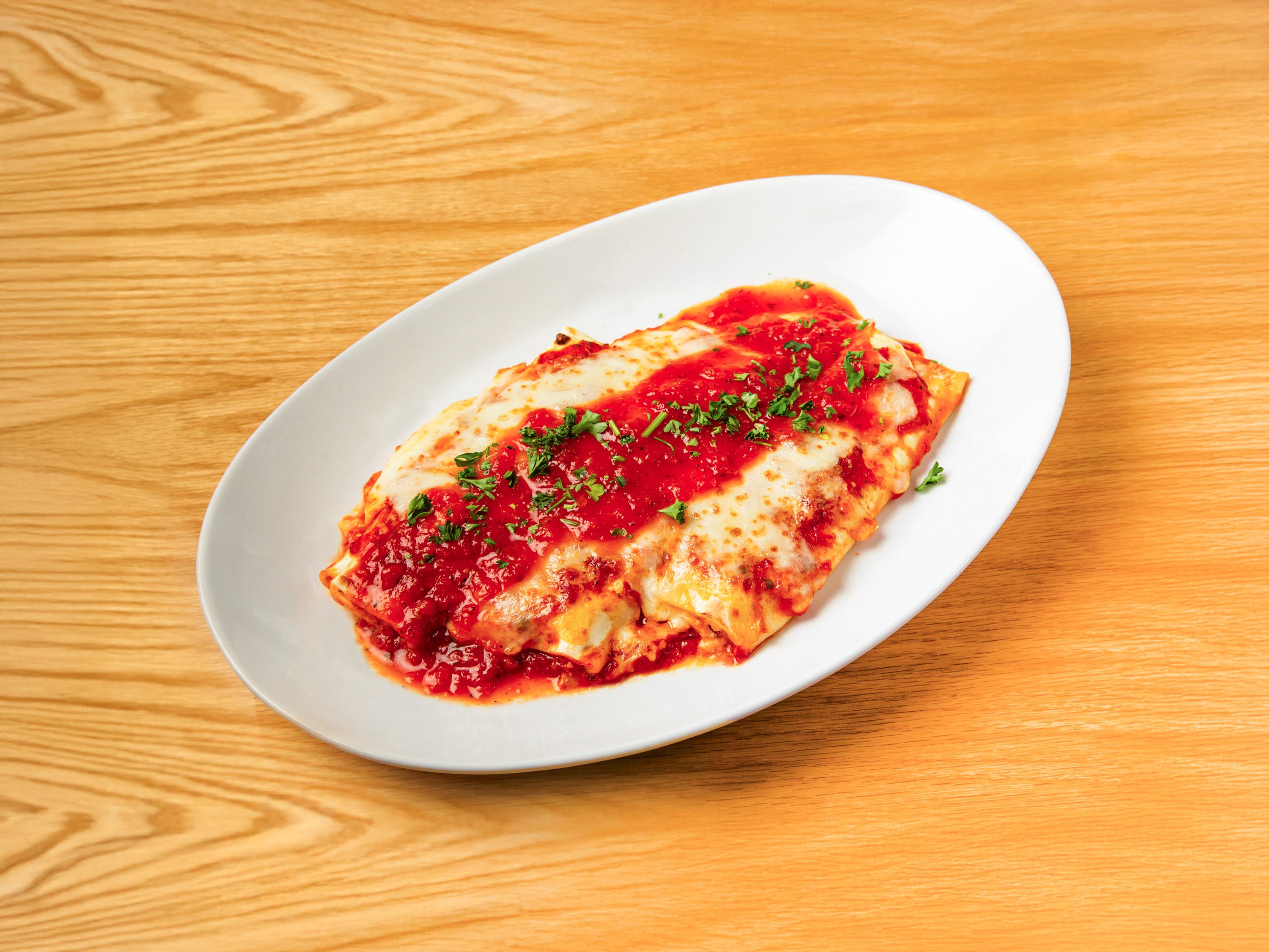 Baked Manicotti Parmigiana.