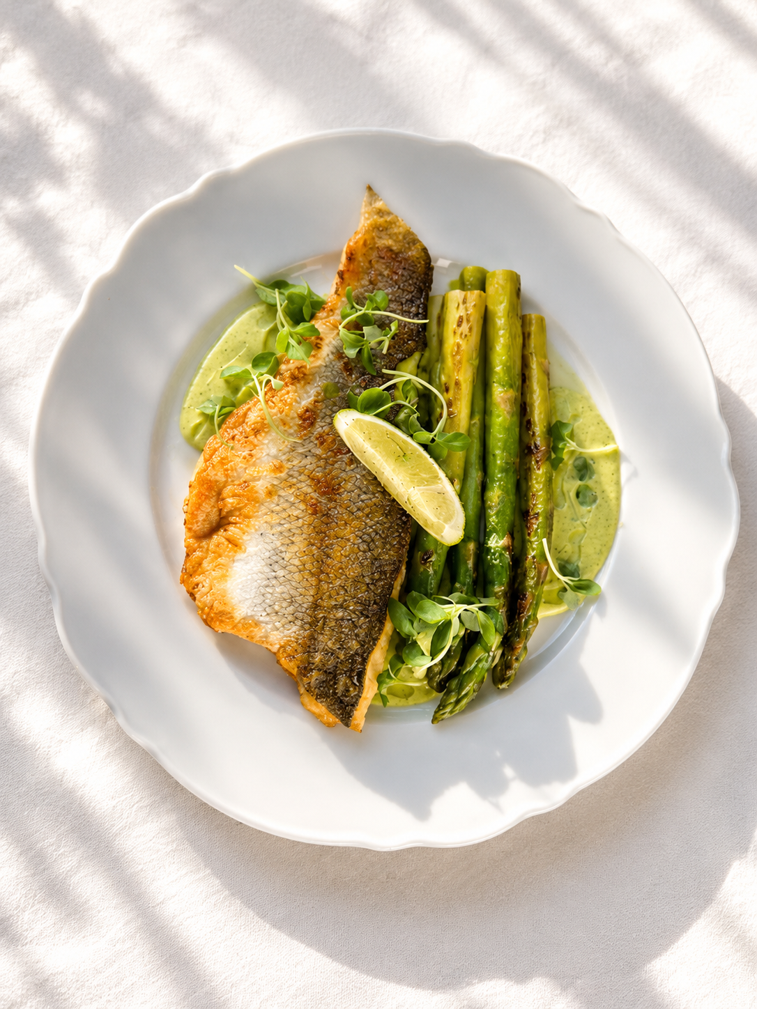 Branzino Fillet with Asparagus and Lime Cream.