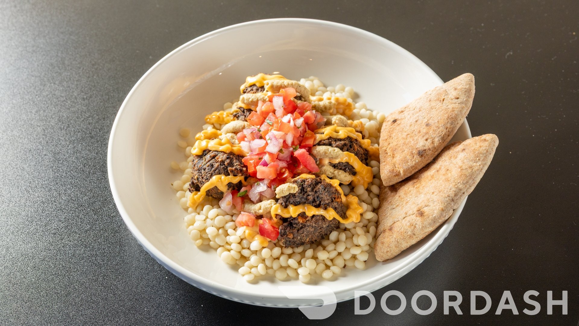 Black Bean Falafel Bowl, Babaghanoush, Chipotle Mayonnaise, Pico de Gallo, 1/2 pita (V).