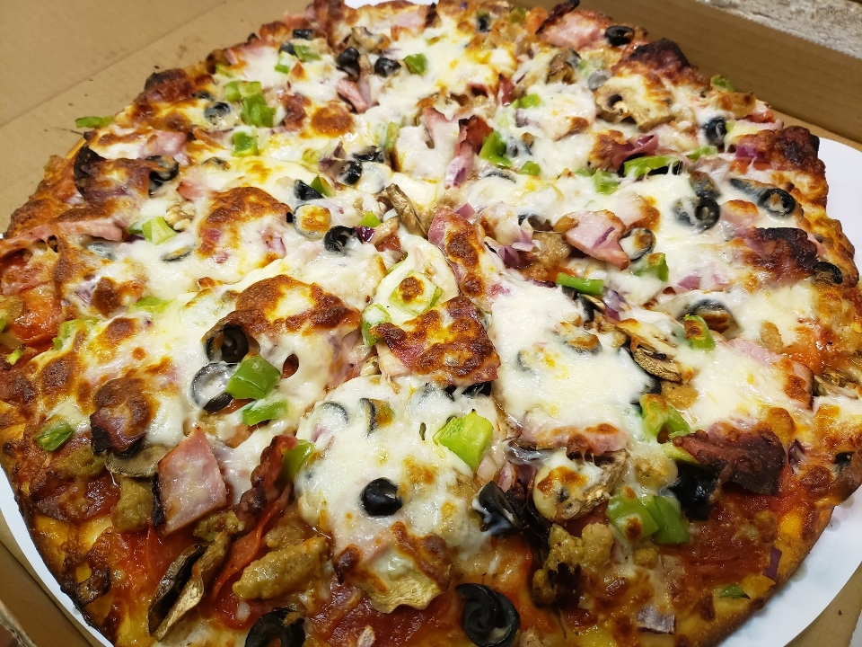 12" Extravaganza Pizza.