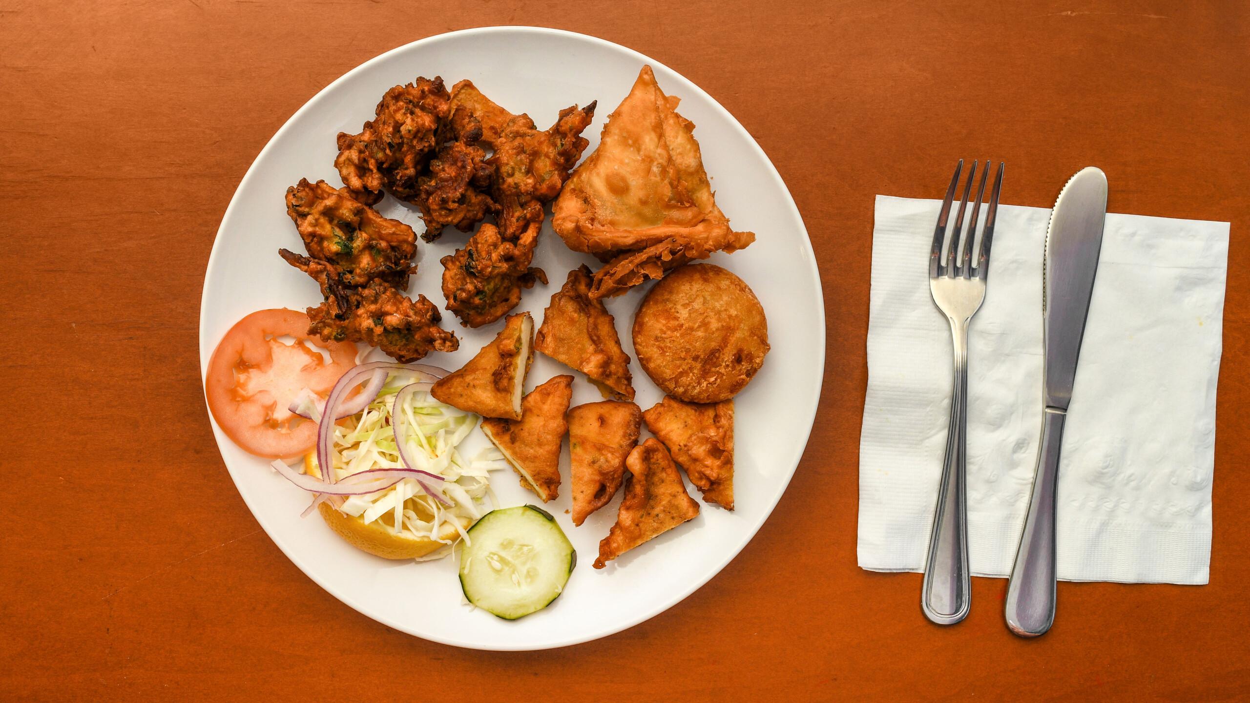 Veg Platter (Mixed Vegetable Pakora, Samosa, and Paneer).