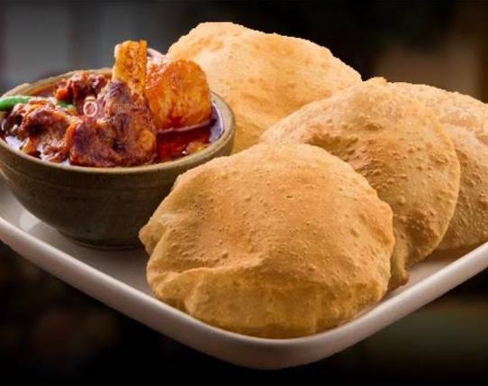 Poori + Goat curry.