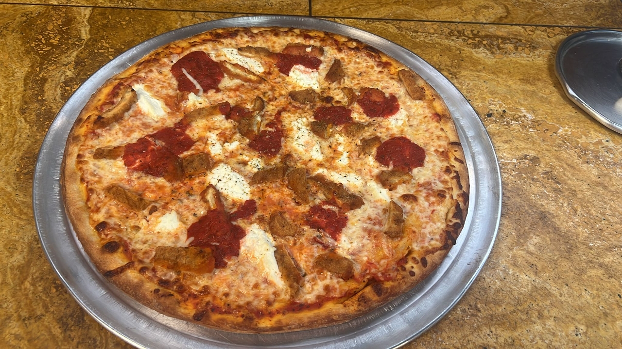 Chicken Parmigiana Supreme Pizza.