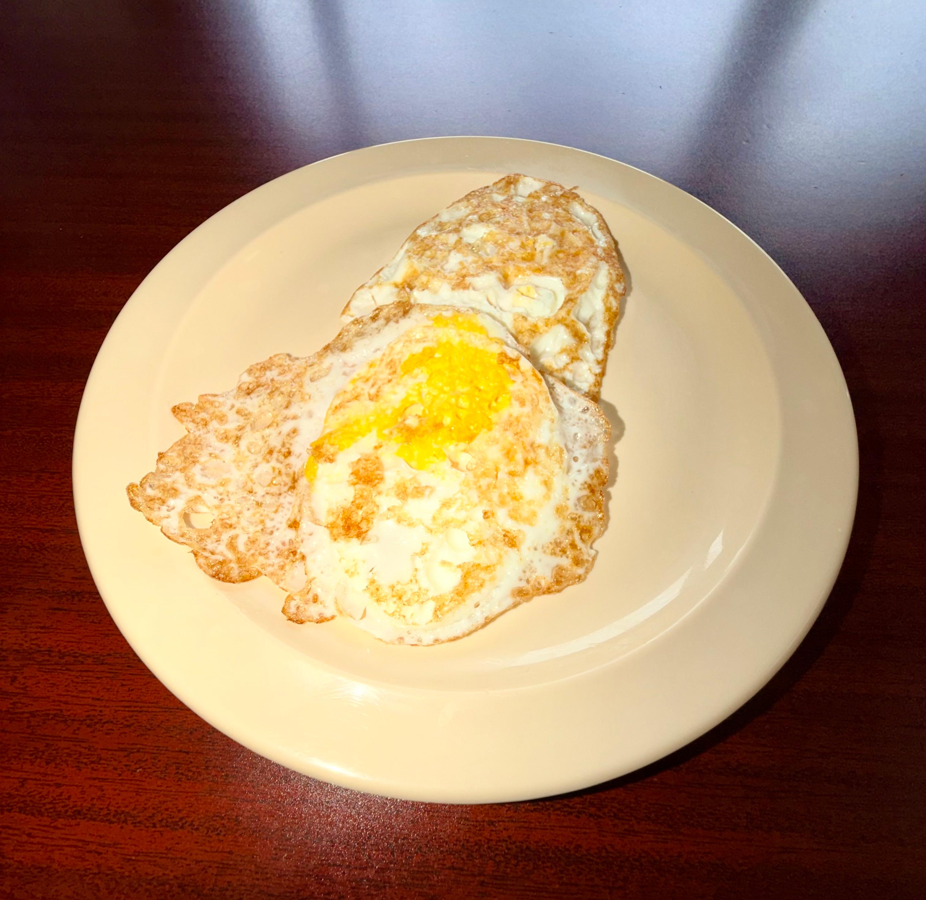 2 Fried Eggs Over Hard.