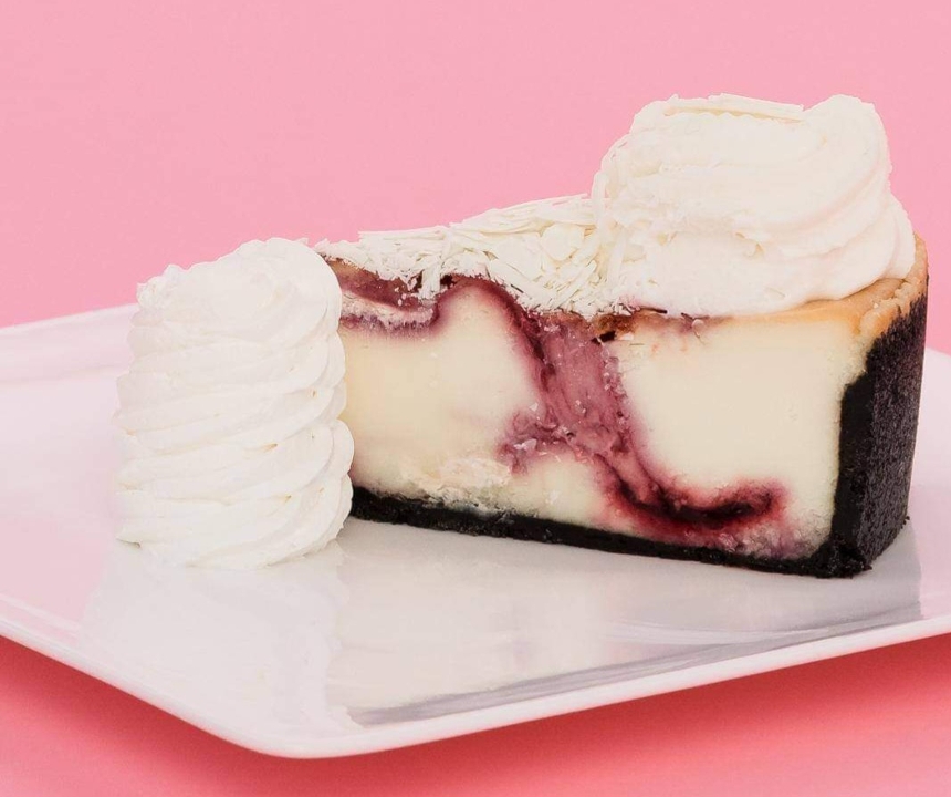 WHITE CHOC RASP CHEESECAKE.