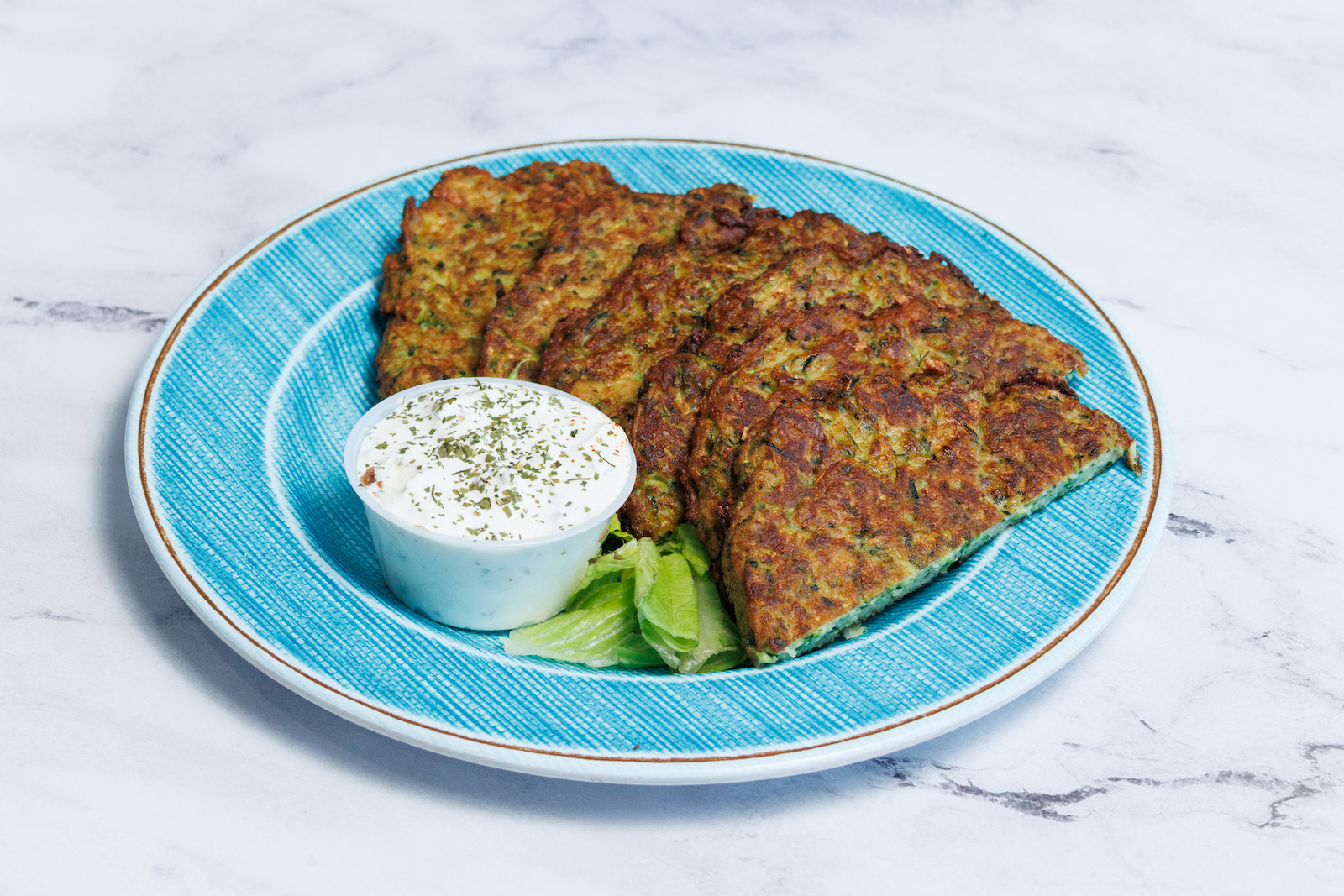 ZUCHINNI FRITERS W/ TZAZIKI SAUCE.