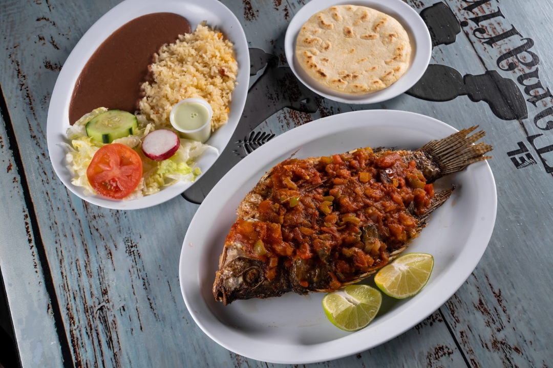 Fried Tilapia in Tomato Sauce - Mojarra Entomatada.