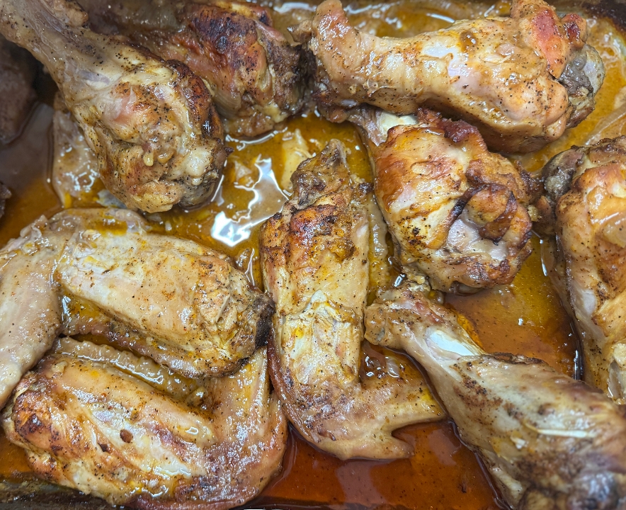 Pit-Smoked & Smothered Jumbo Turkey Wings and side.
