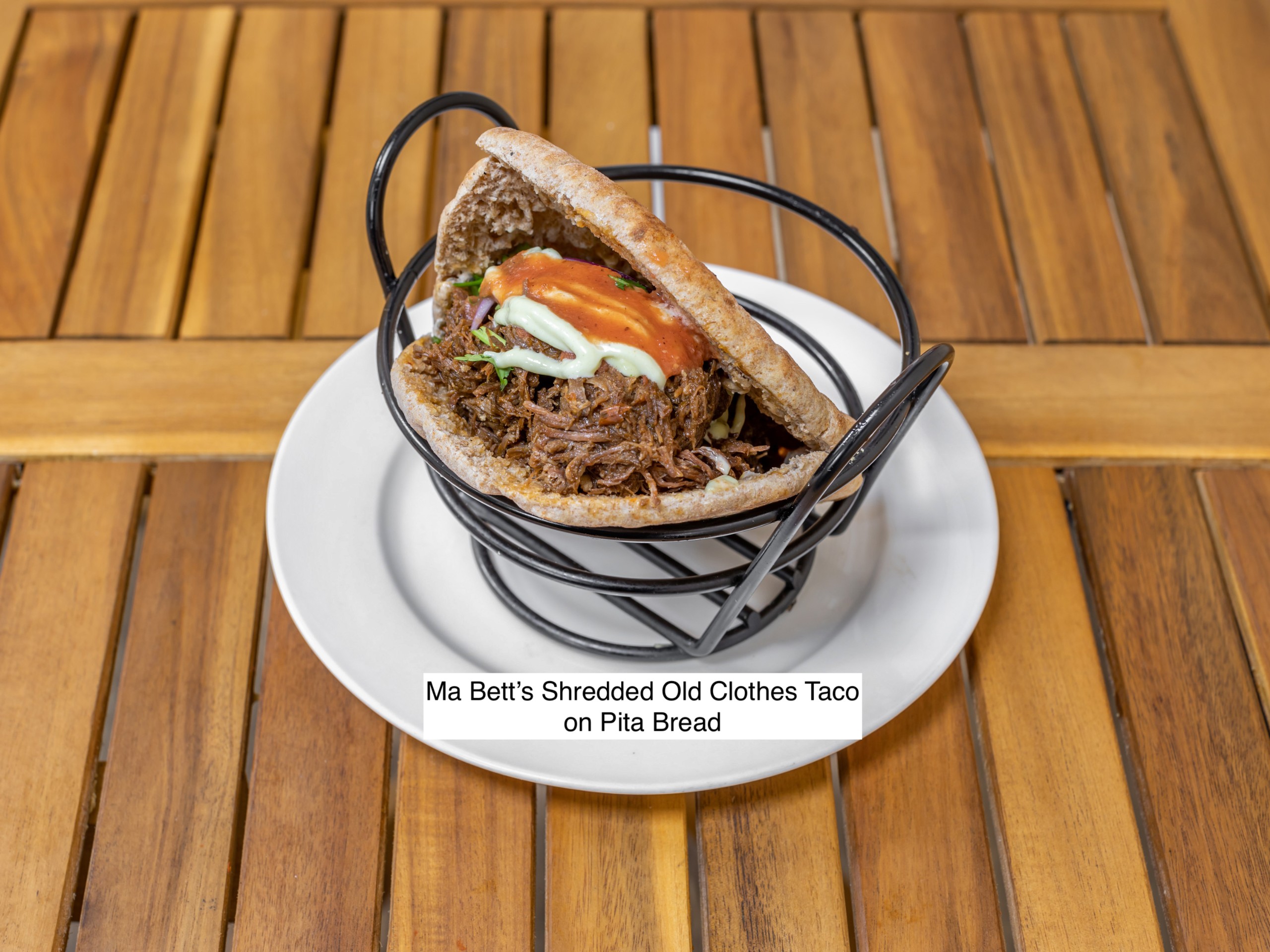 Ma Bett's Ropa Vieja Brisket, Zhug Mayo, Roasted Tomato Salsa, Pickled Onions Cilantro.
