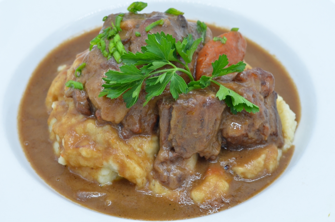 SOUTHERN SMOTHERED OXTAILS.