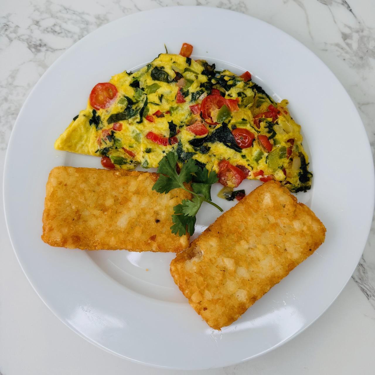 Garden Omelette, served with Home Fries and a Bagel.