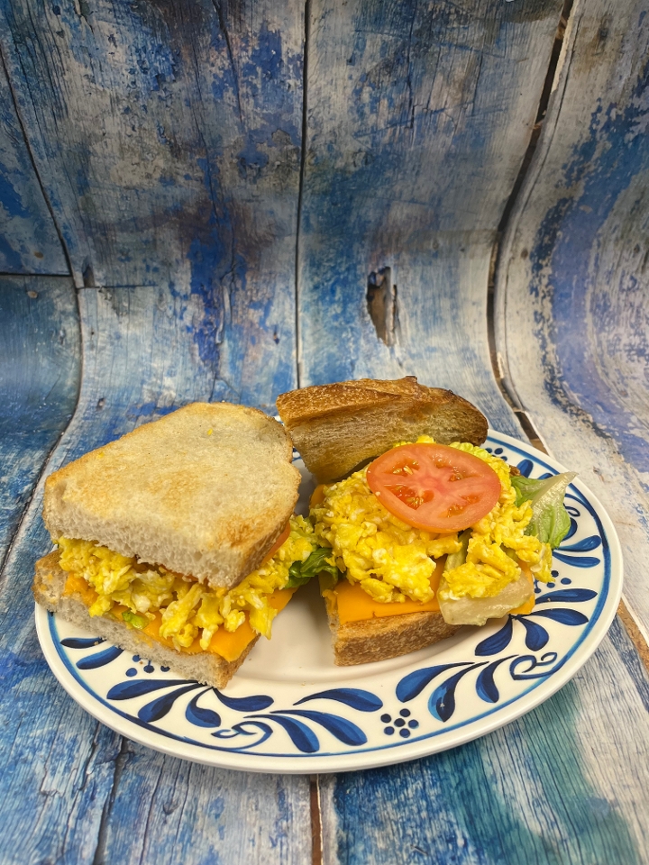 CHEESY OINK OINK BREAKFAST SANDWICH.