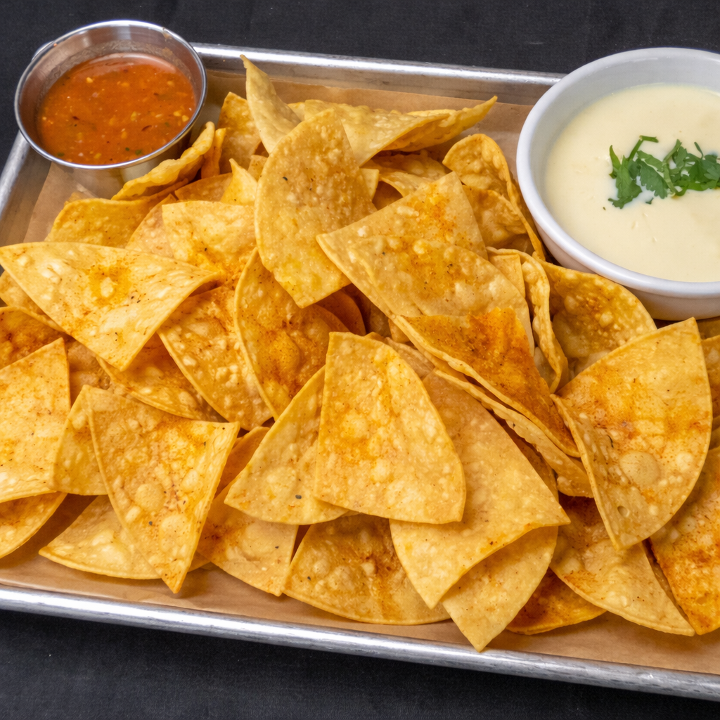 Homemade Tortilla Chips and Queso.