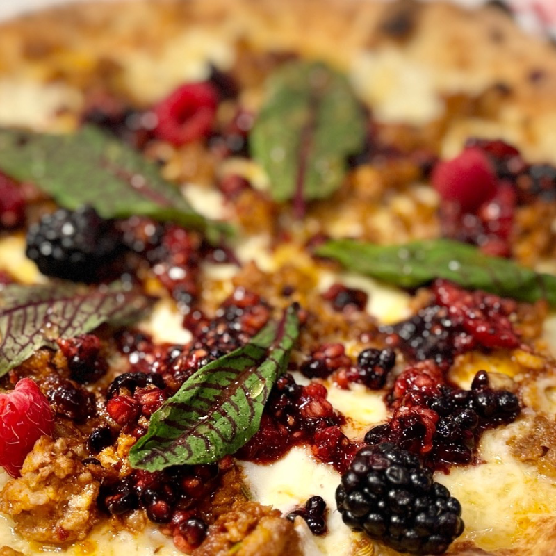 Spring Sorrel, Hot Sausage , Macerated Berries finished  with Hot Honey and Balsamic Glaze.