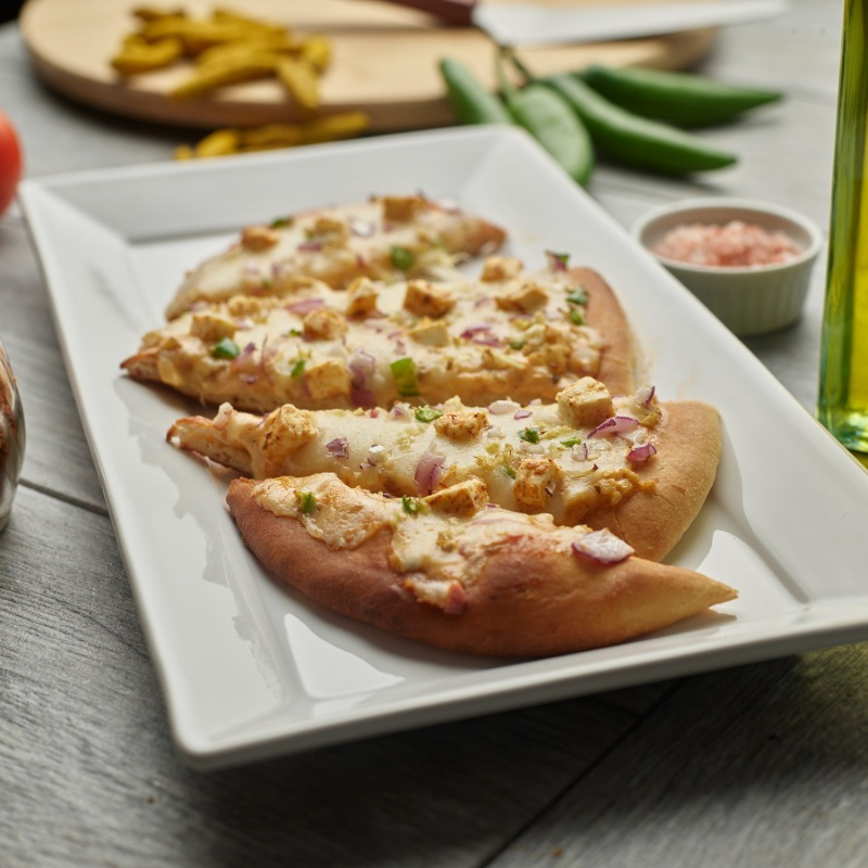 Shahi Paneer Naan Pizza.