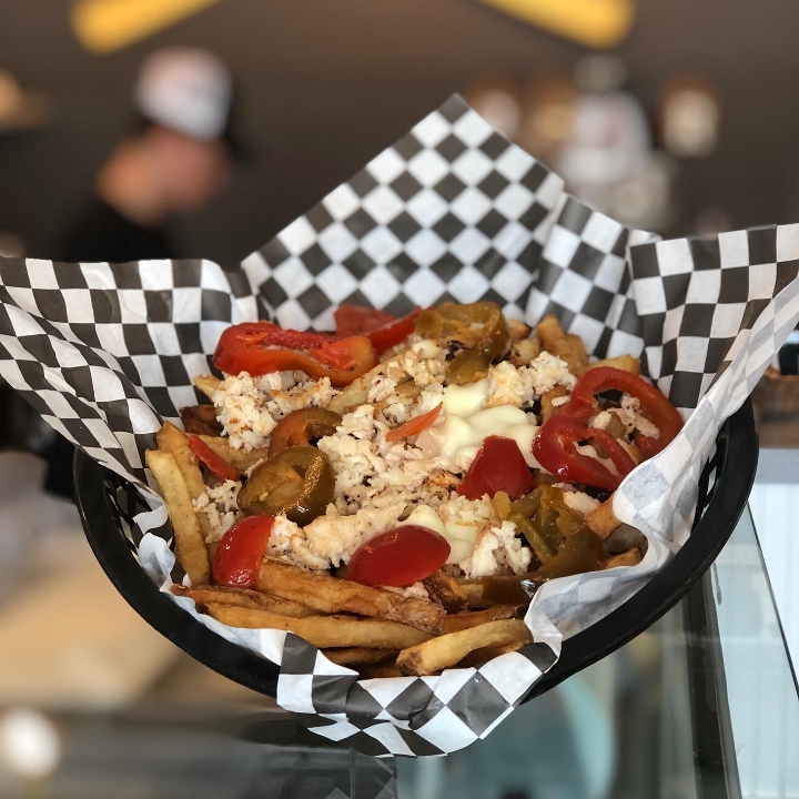 Chicken Cheesesteak Basket Fries With Cherry Peppers.