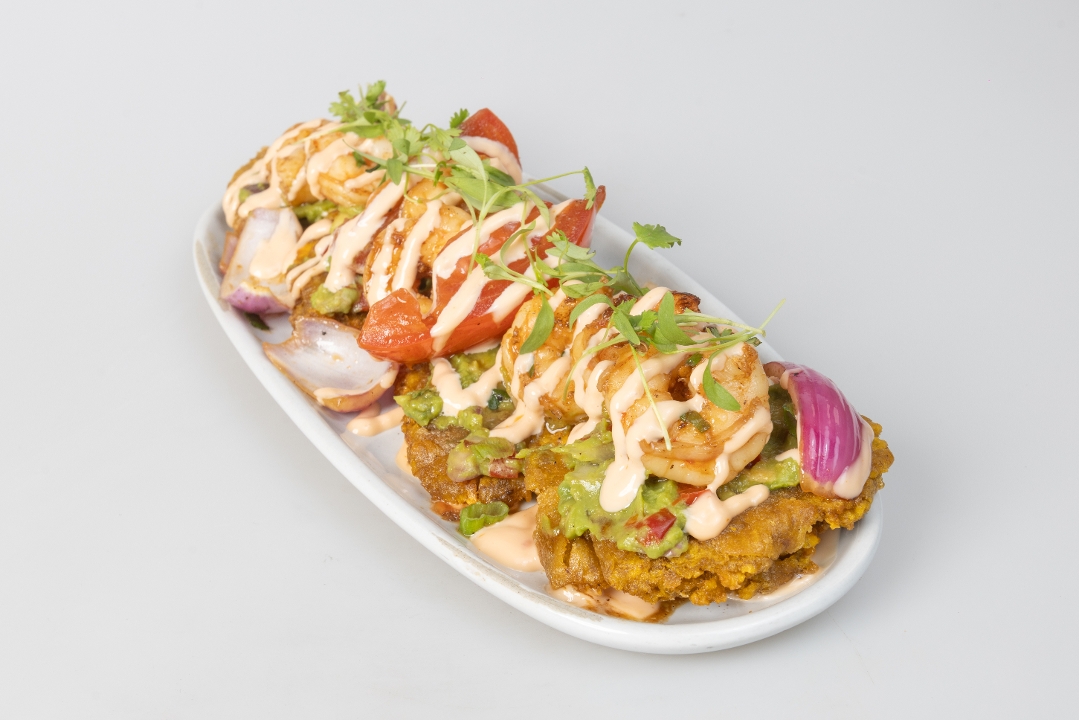 Fried Green Plantains with shrimp and Guasacaca.