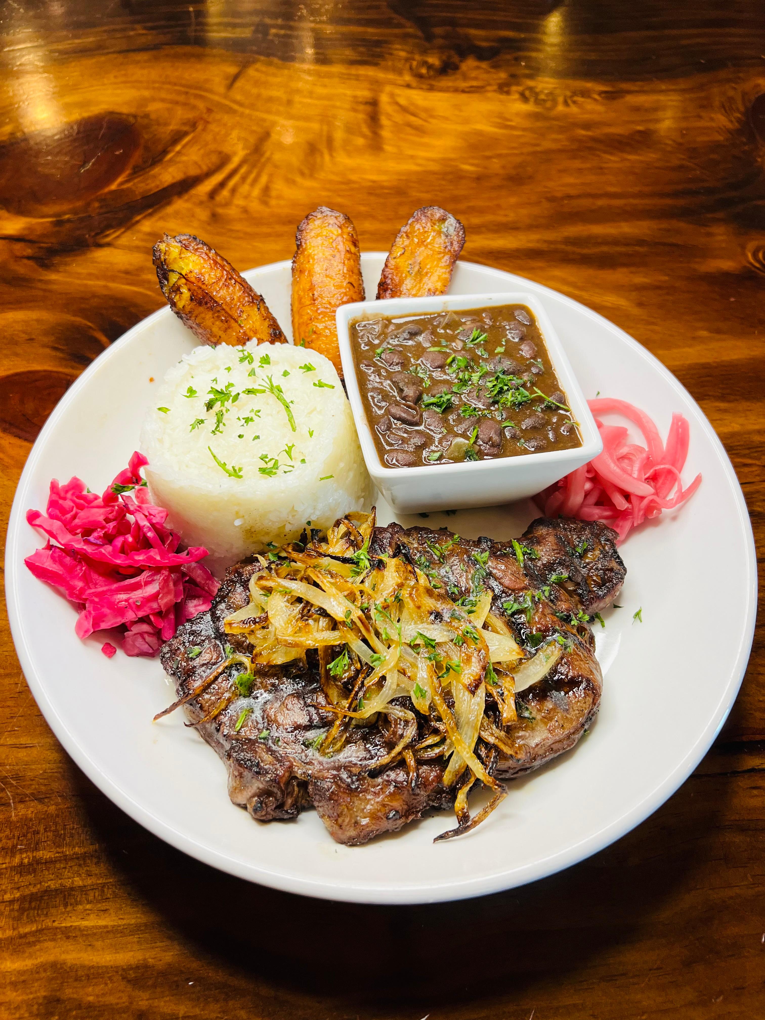 12oz Ribeye Bistec Encebollado | Steak with Sautéed Onions.