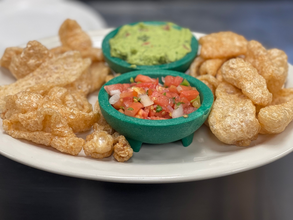 Pork Rinds (chicharrones) with guacamole and pico de gallo.