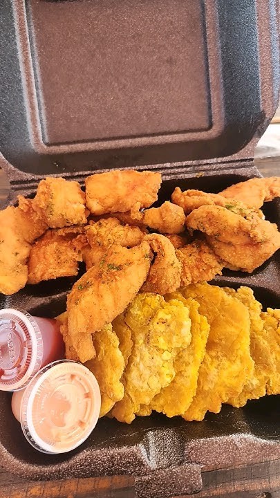 CHICKEN TENDERS WITH TOSTONES.