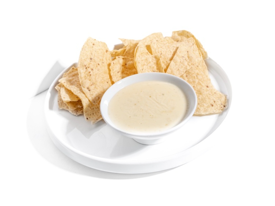 WHITE QUESO  DIP AND CHIPS.