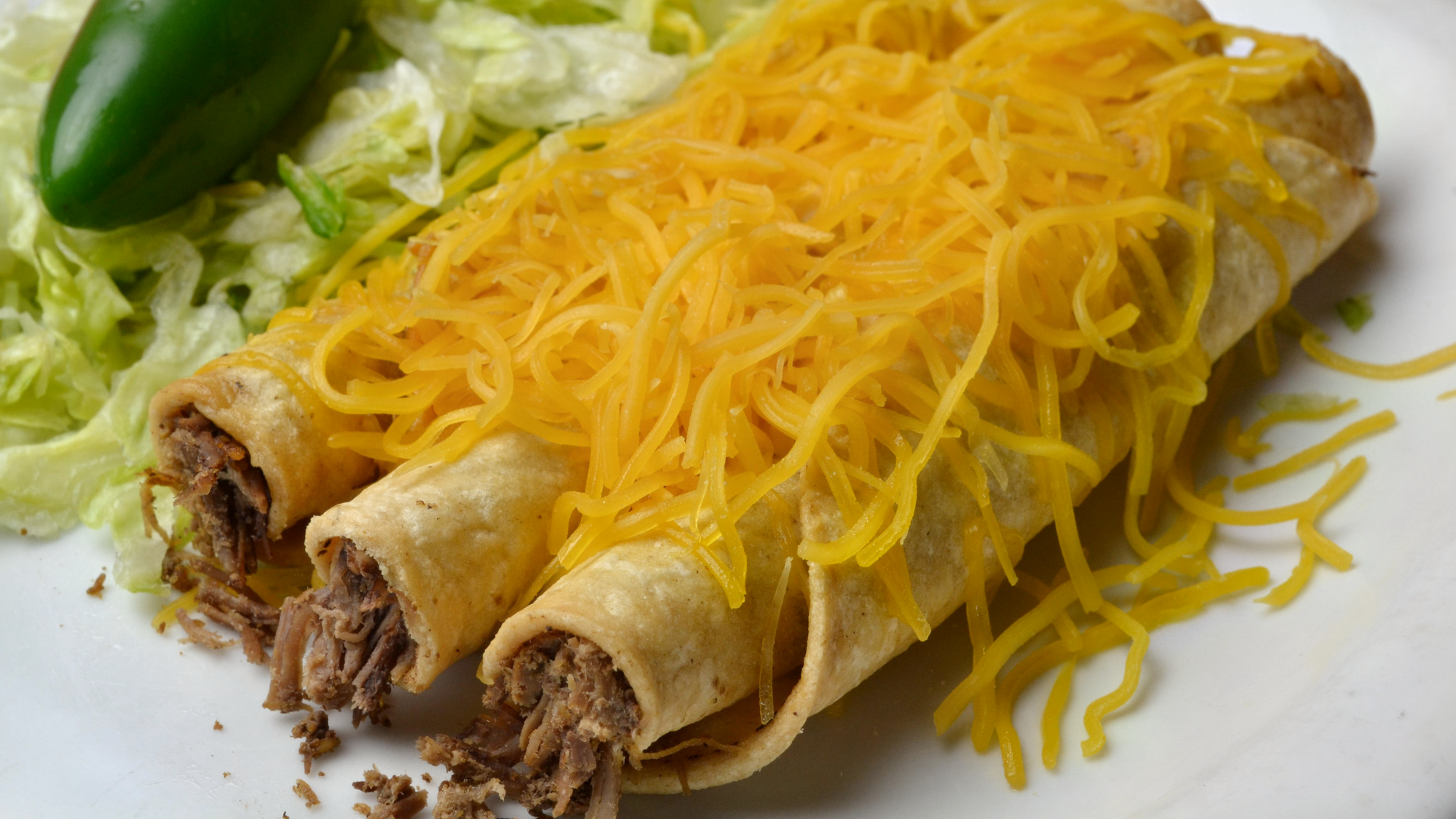 #2 3 Rolled Tacos with Cheese.