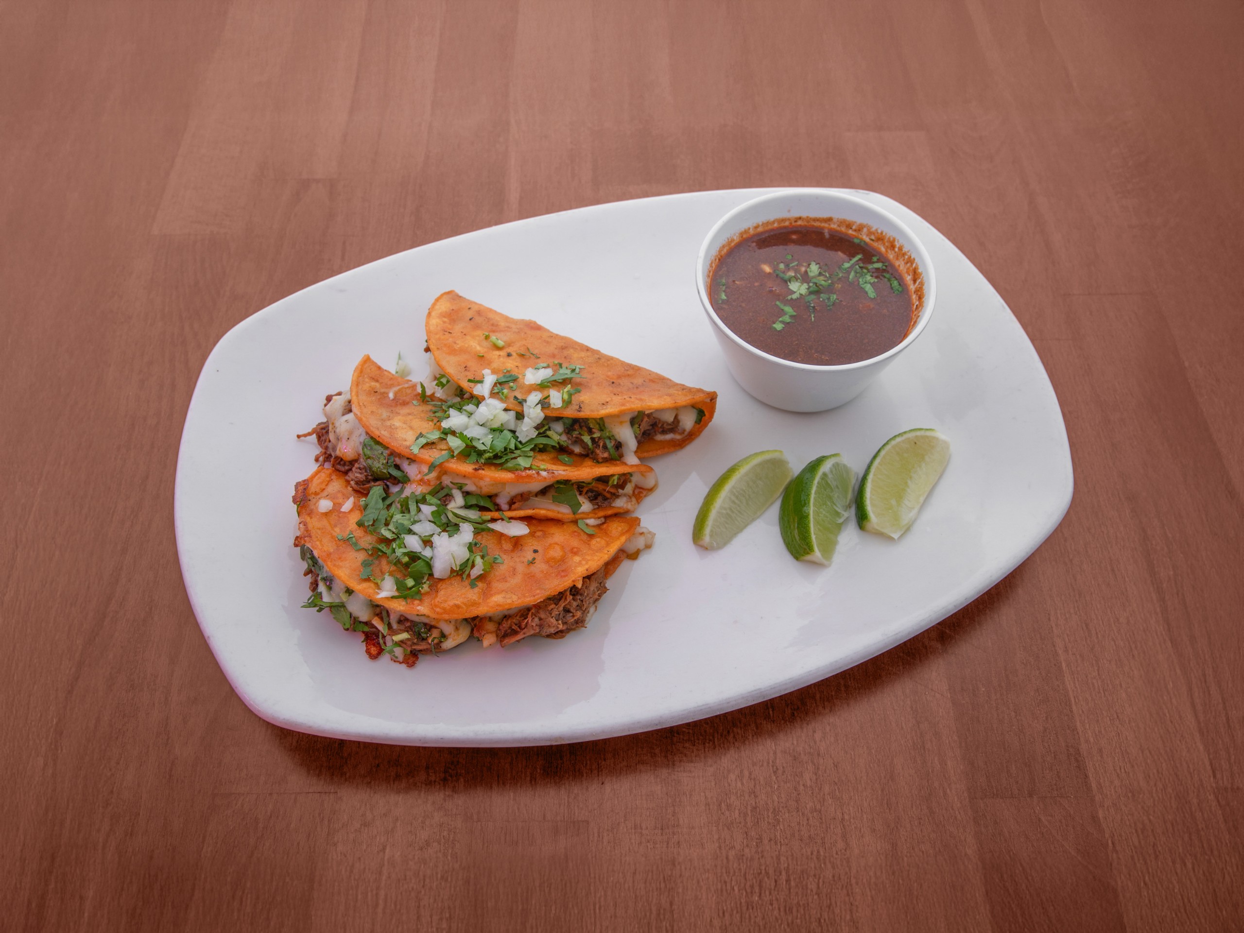 3 Pieces of Birria Quesadillas with Consomme.