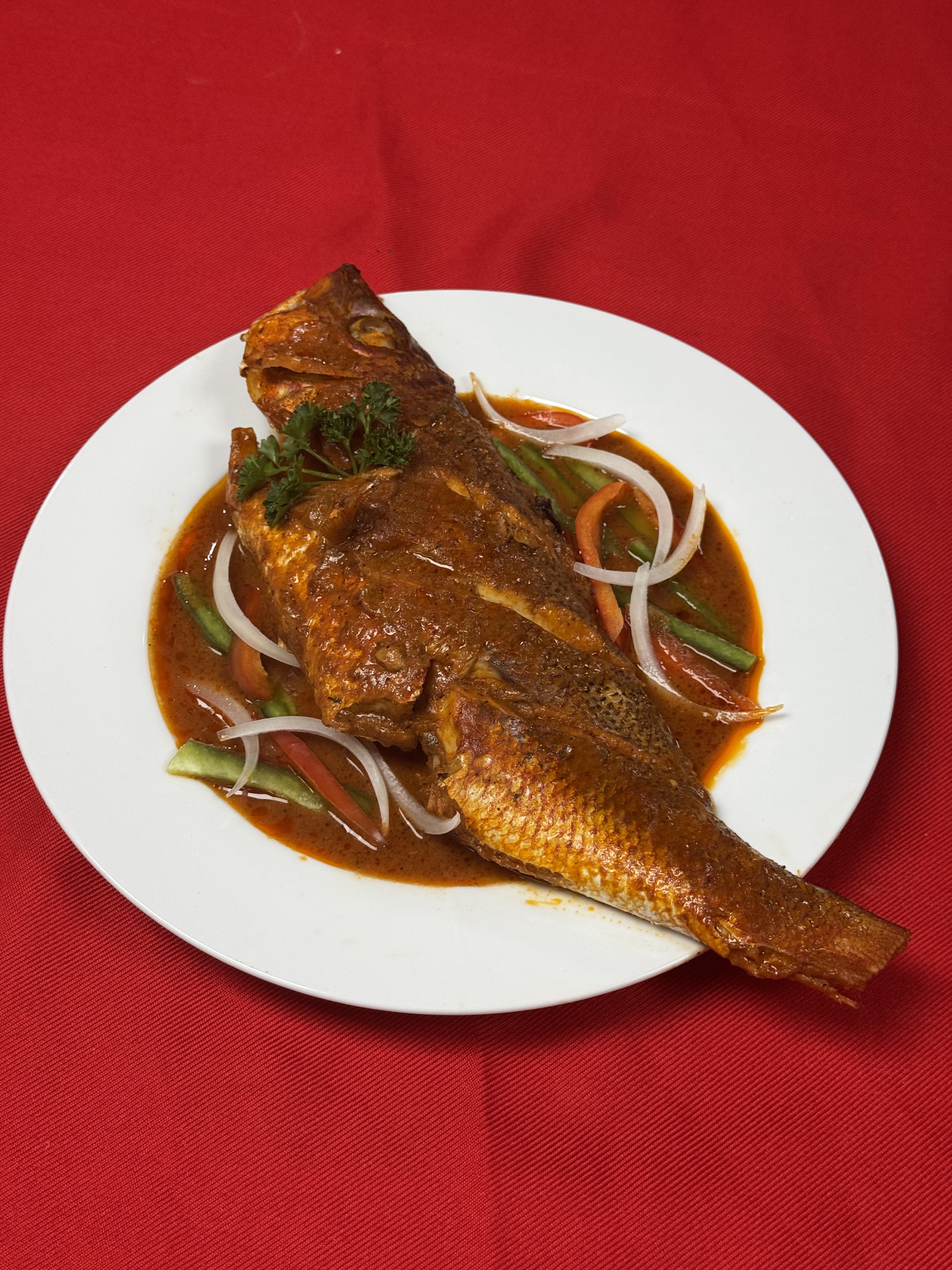 Poisson Rose ak sòs (Red snapper stew).