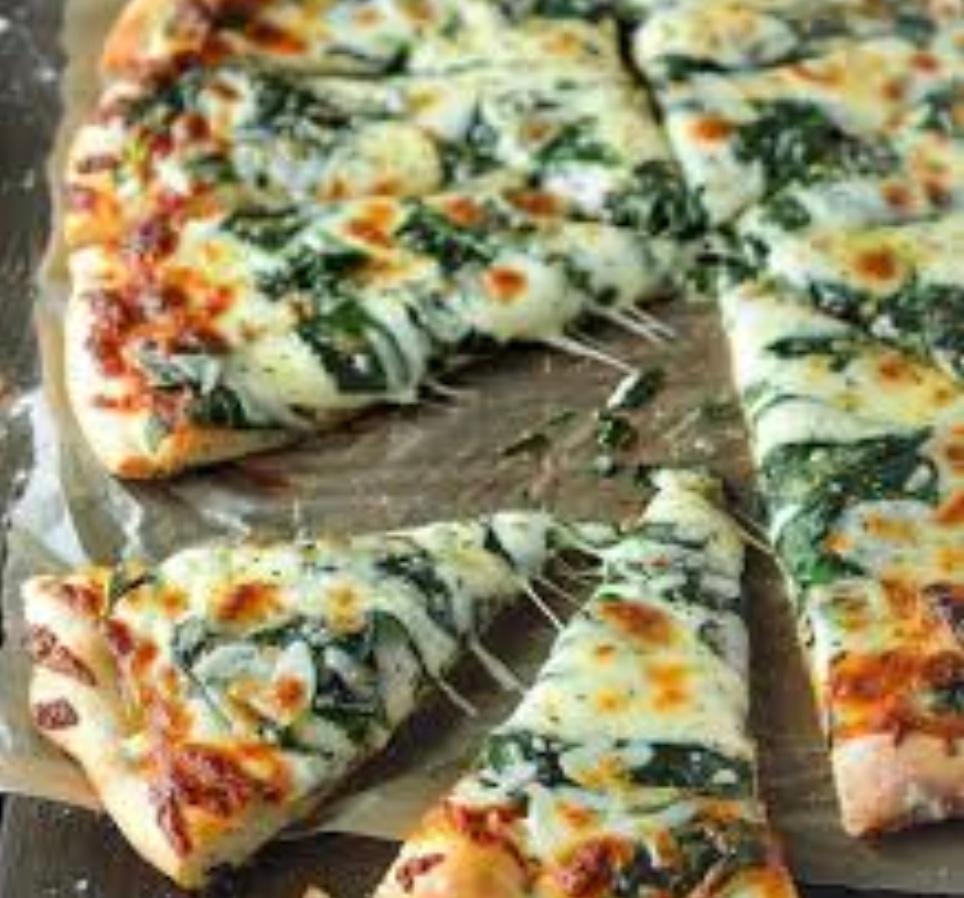 WHITE SLICE WITH GARLIC AND SPINACH.