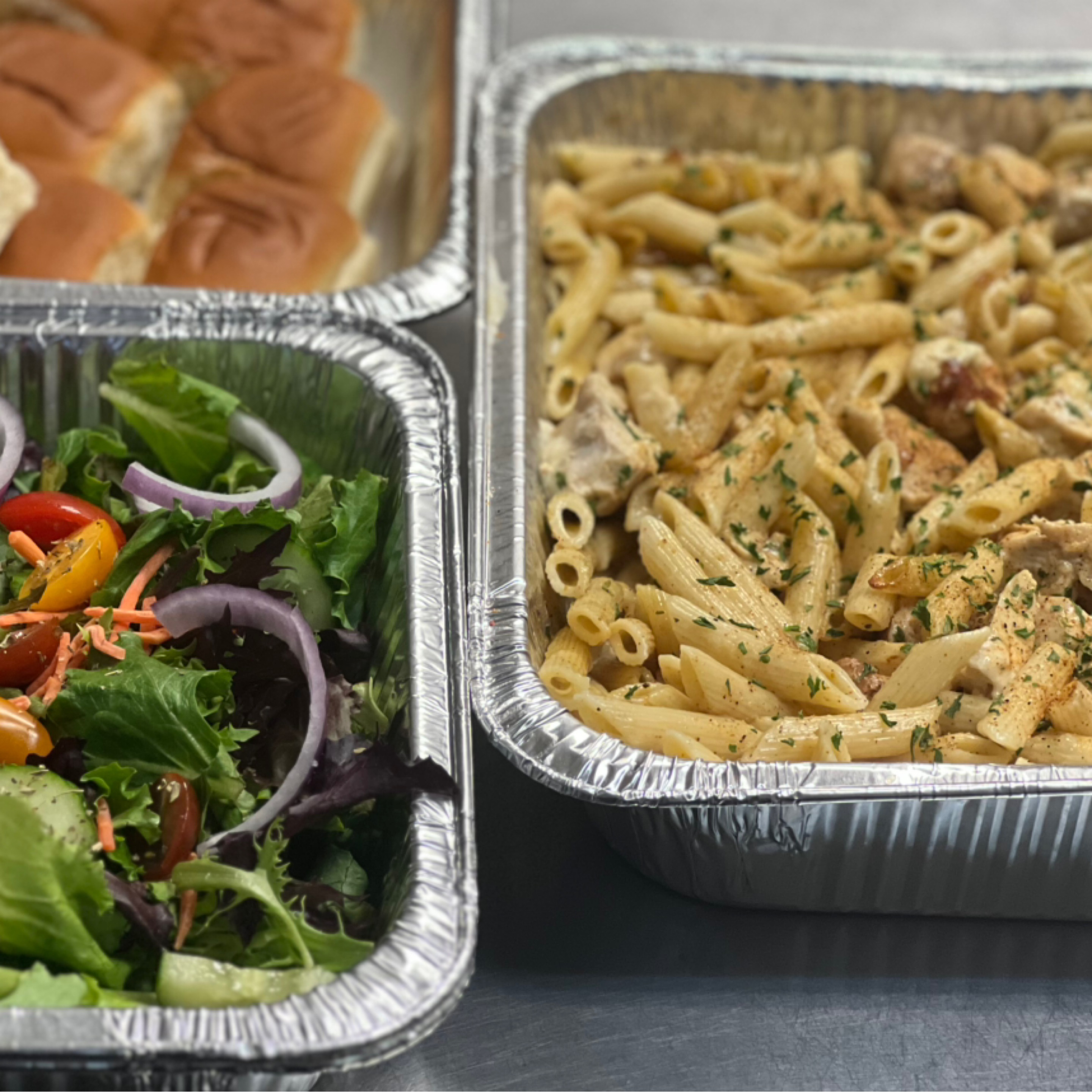 Half Pan Cajun Chicken Pasta with Salad and Bread Stick.