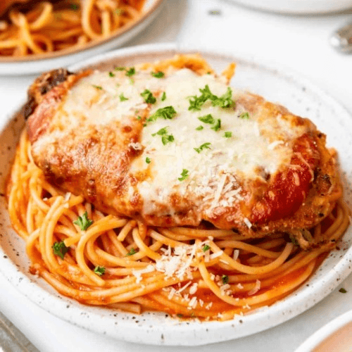 CHICKEN PARMIGIANA WITH PASTA ENTRÉE.