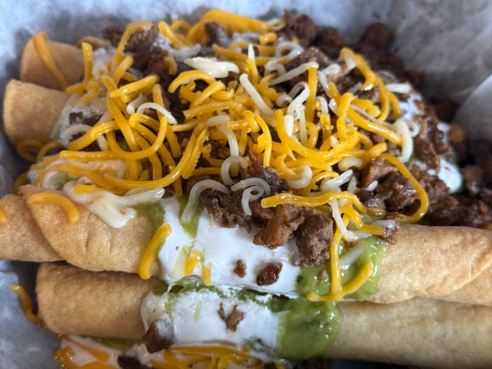 5 Rolled Tacos with Carne Asada.