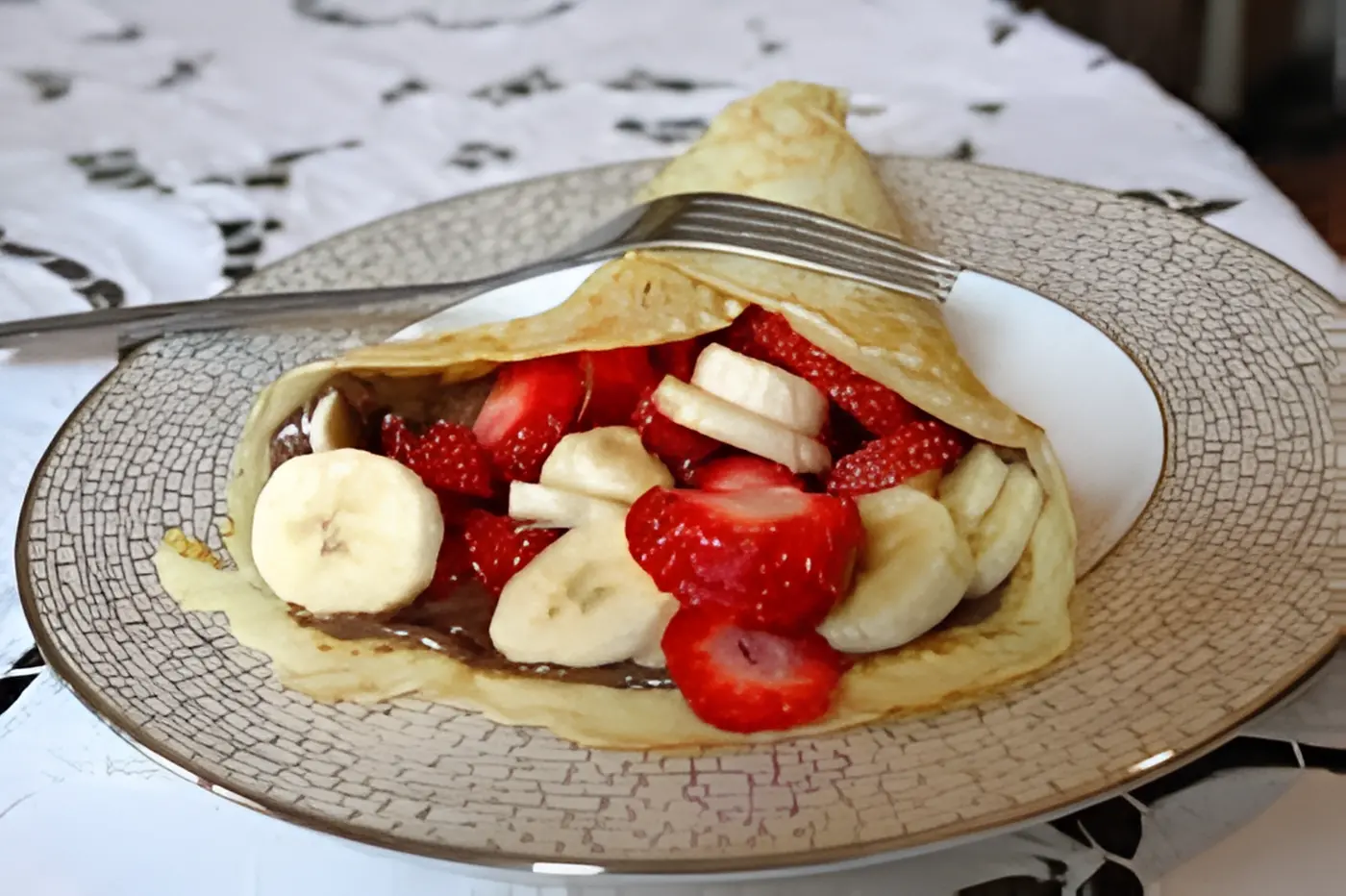 Nutella Banana, Strawberry, almond Crepe.