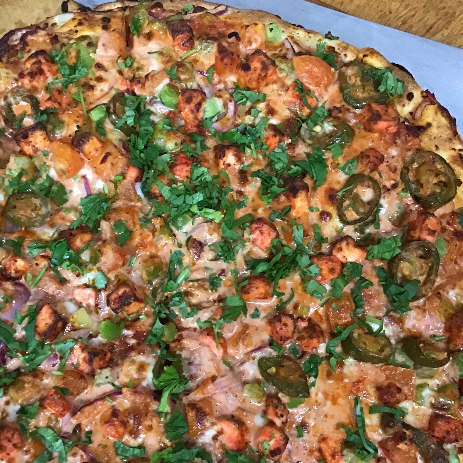 Butter Paneer Masala Veggie Pizza.
