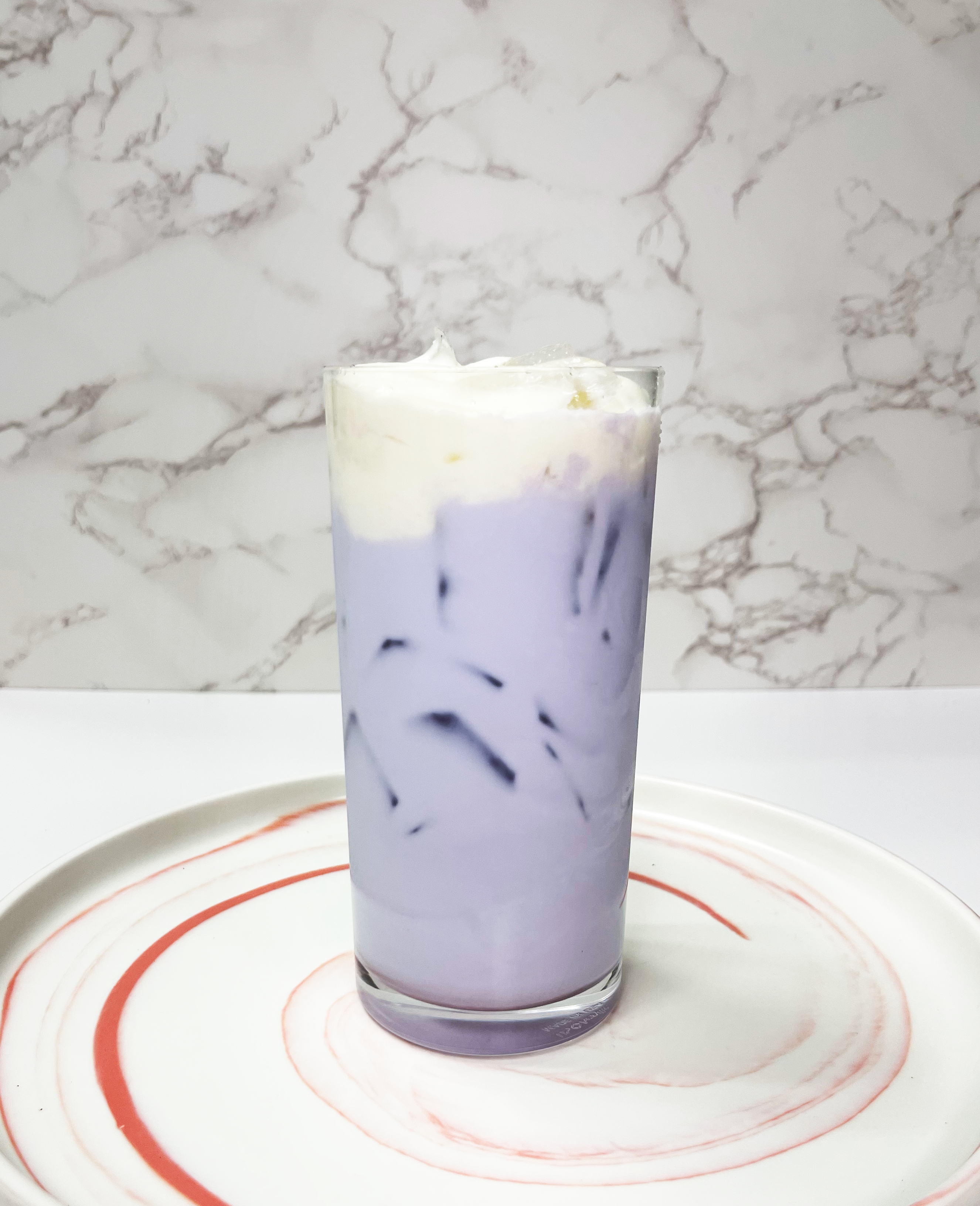 Taro Latte w/sweet cream.