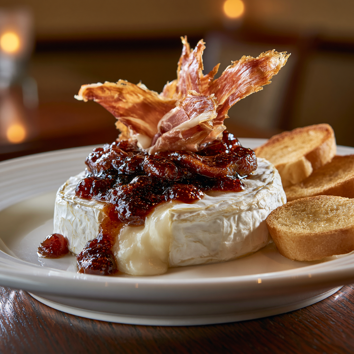 Baked Brie with Fig Preserves & Prosciutto.