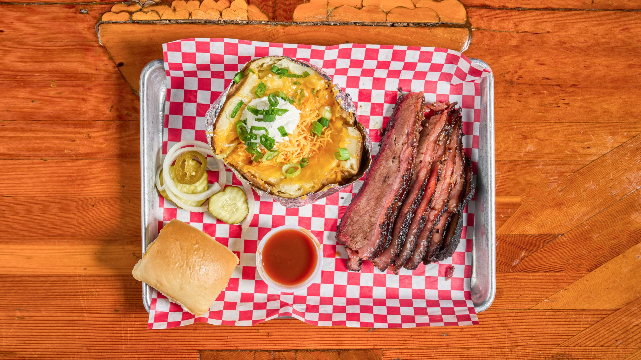 Sliced Brisket Plate with Baked Potato.