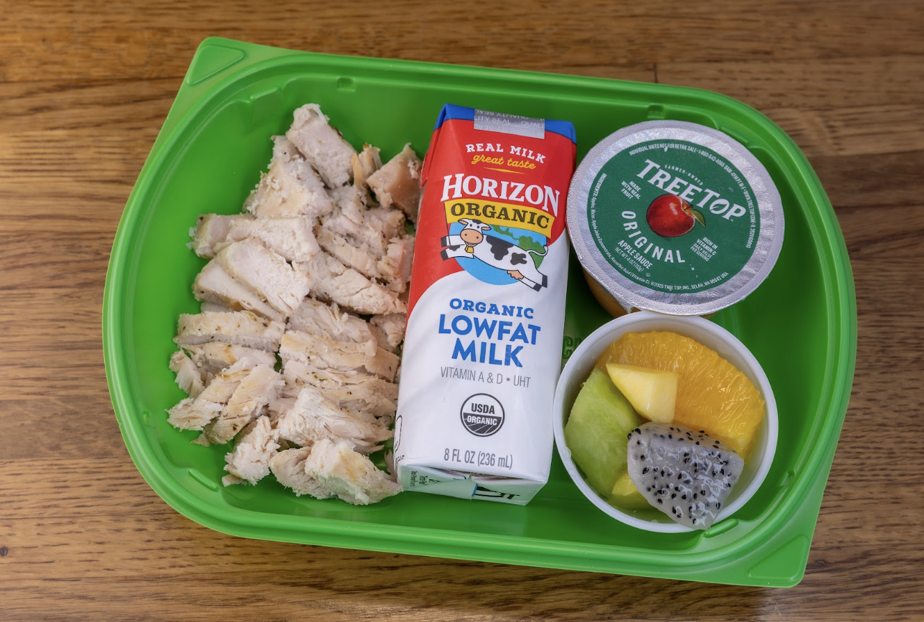 Plate w/ chicken and fruit.