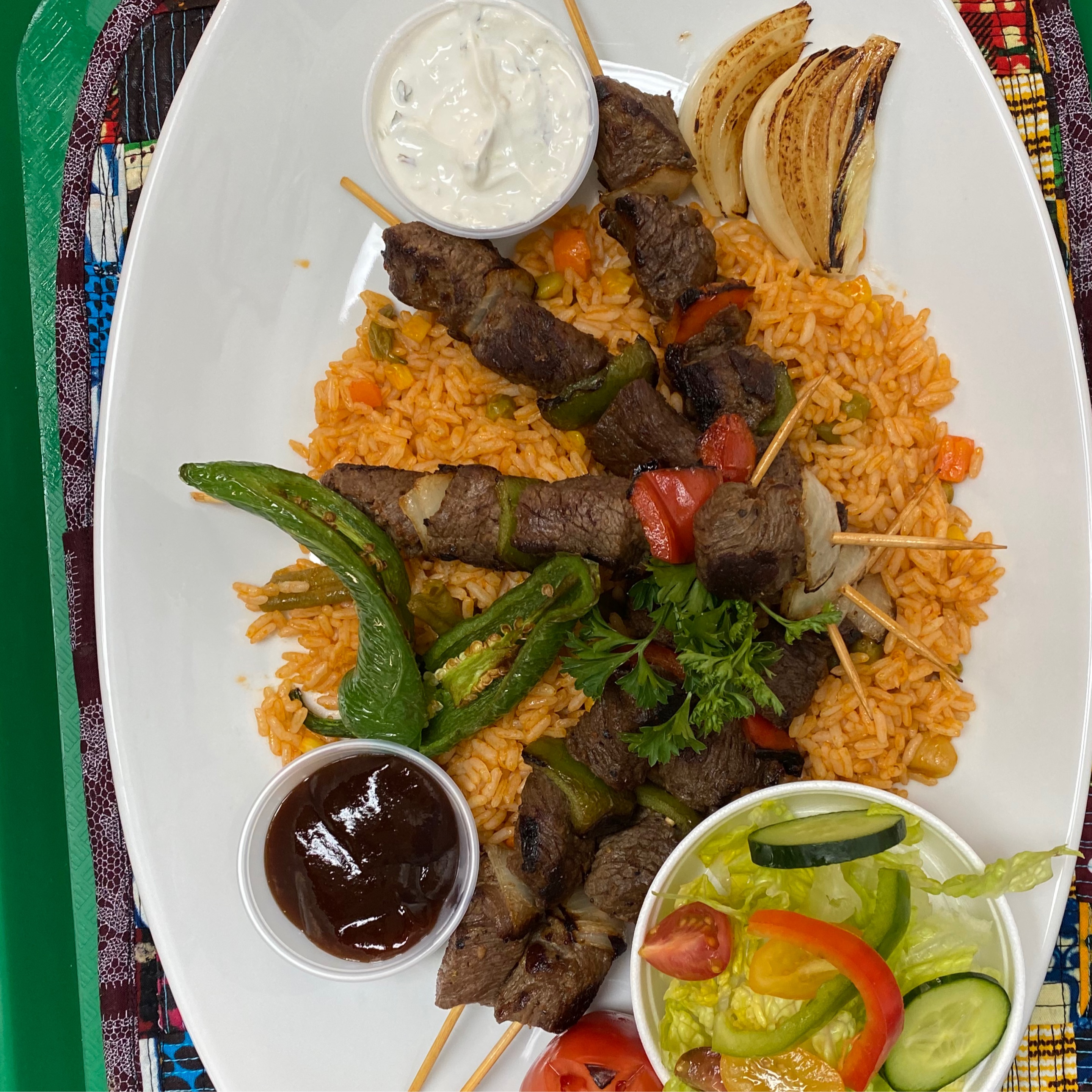 Beef Kabob (2 sticks) with Jollof Rice and Salad.