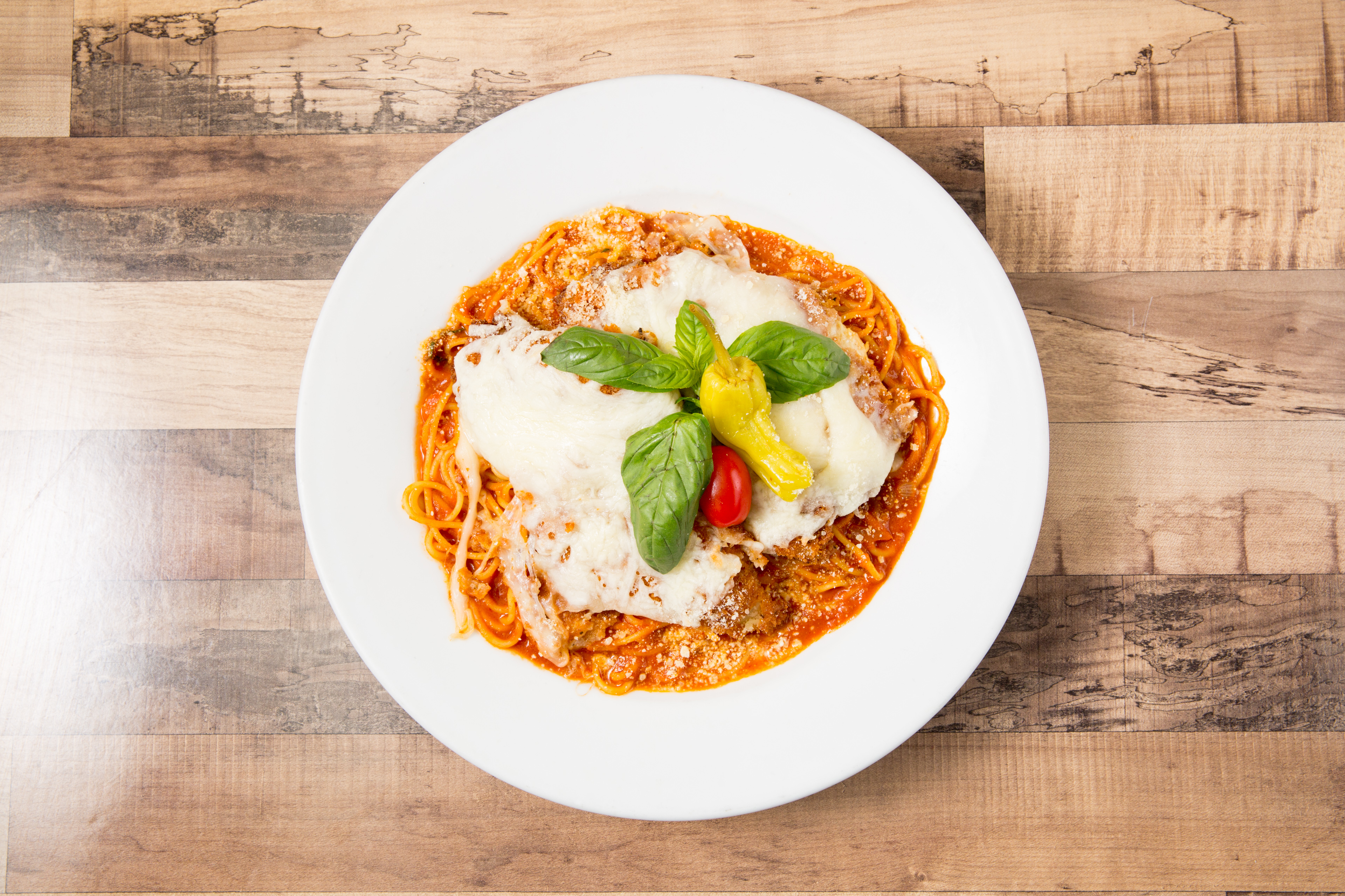 Chicken Parmesan over Spaghetti.