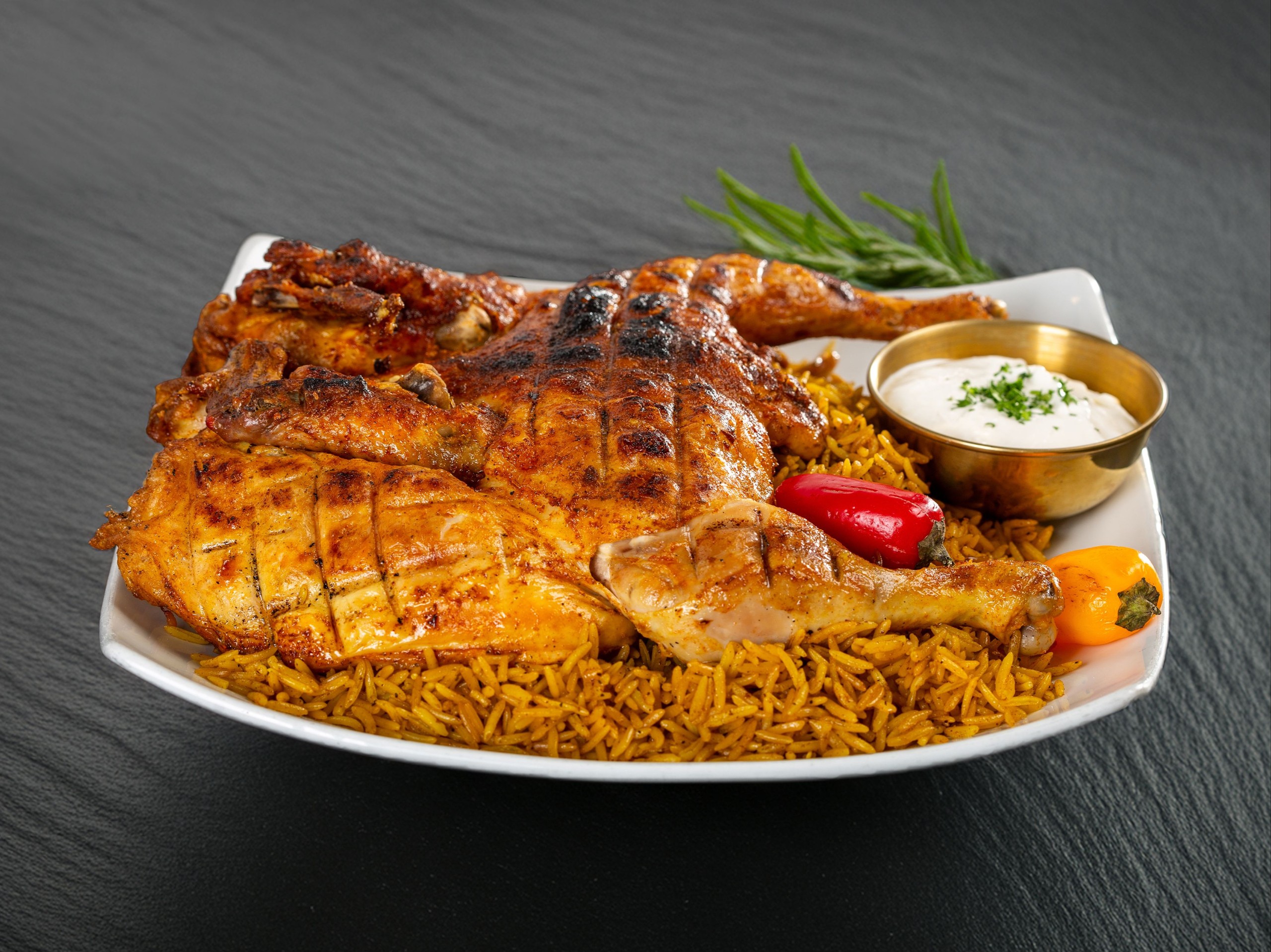 Whole Chicken with Rice / دجاجة كاملة تقدم مع الرز.