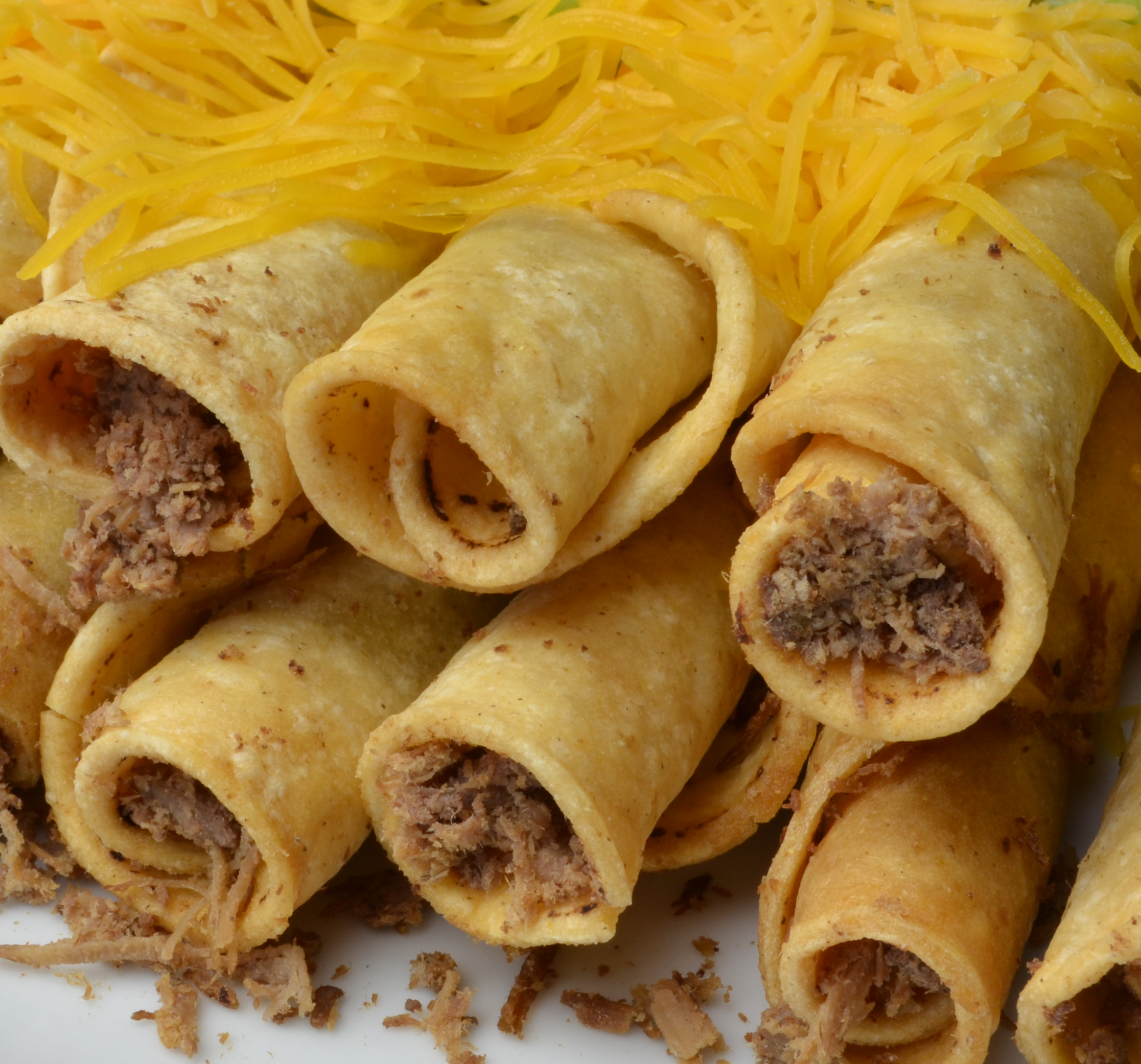 20 Rolled Tacos with Cheese.