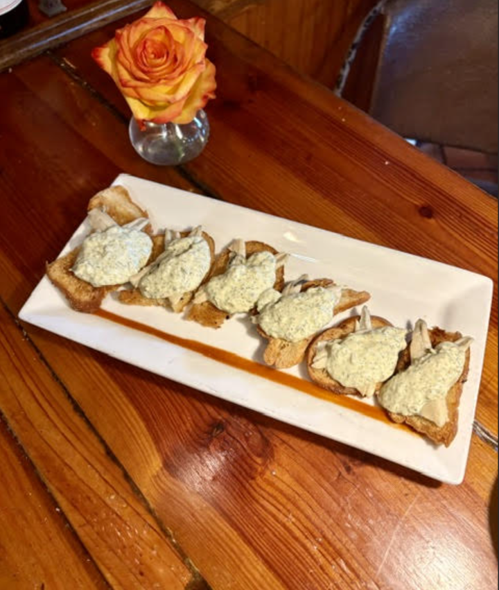 Fresh Anchovies Served Hot on Crostini.