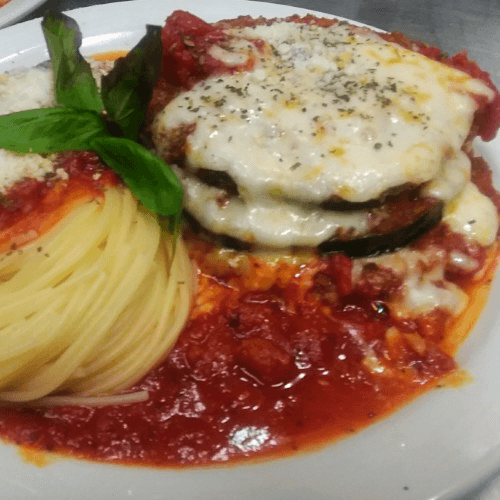 EGGPLANT PARMIGIANA WITH PASTA ENTRÉE.