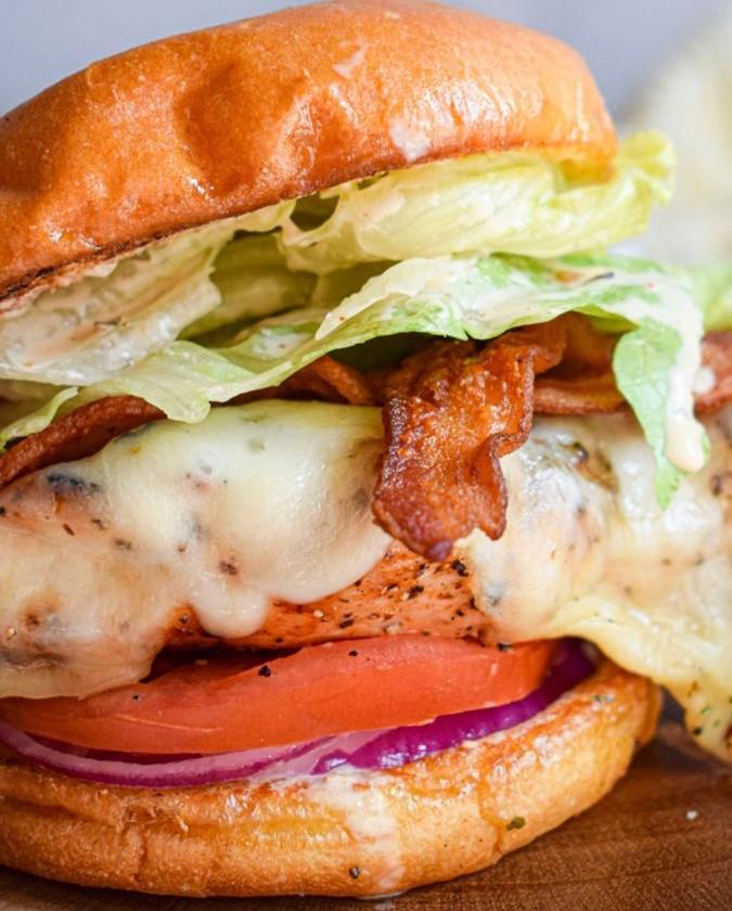 Chicken Sandwich On The Bun With Fries.